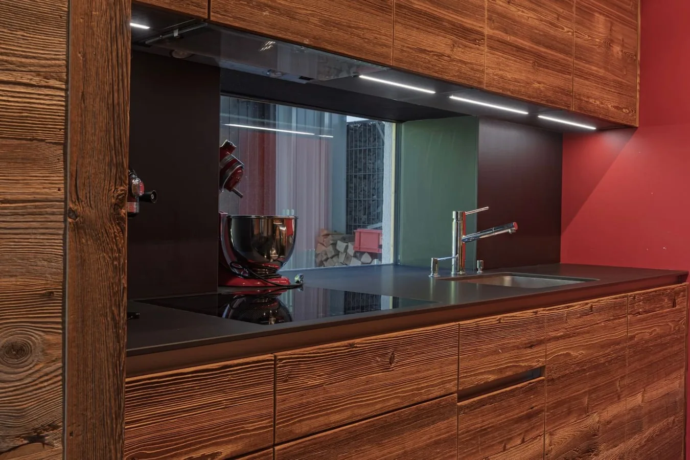 Fitted kitchen in old wood and black granite with Miele oven, apartment in Villars