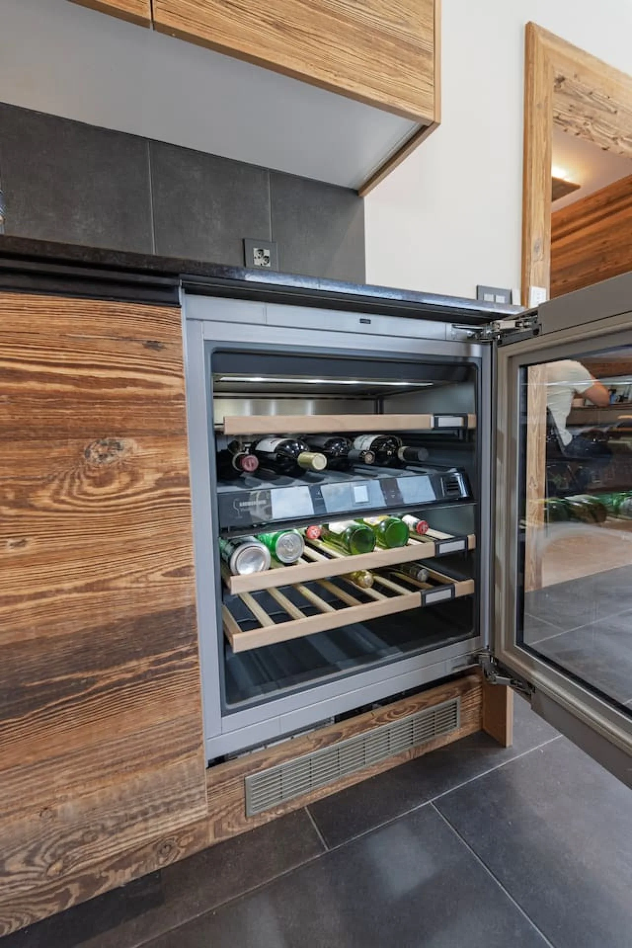 Built-in wine cellar in the kitchen, old-wood chalet apartment in Villars-sur-Ollon