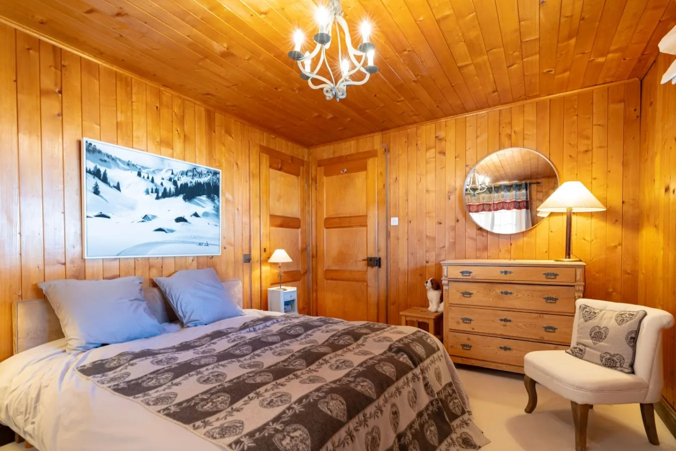 Panelled double bedroom with king-size bed, family chalet in Villars-sur-Ollon