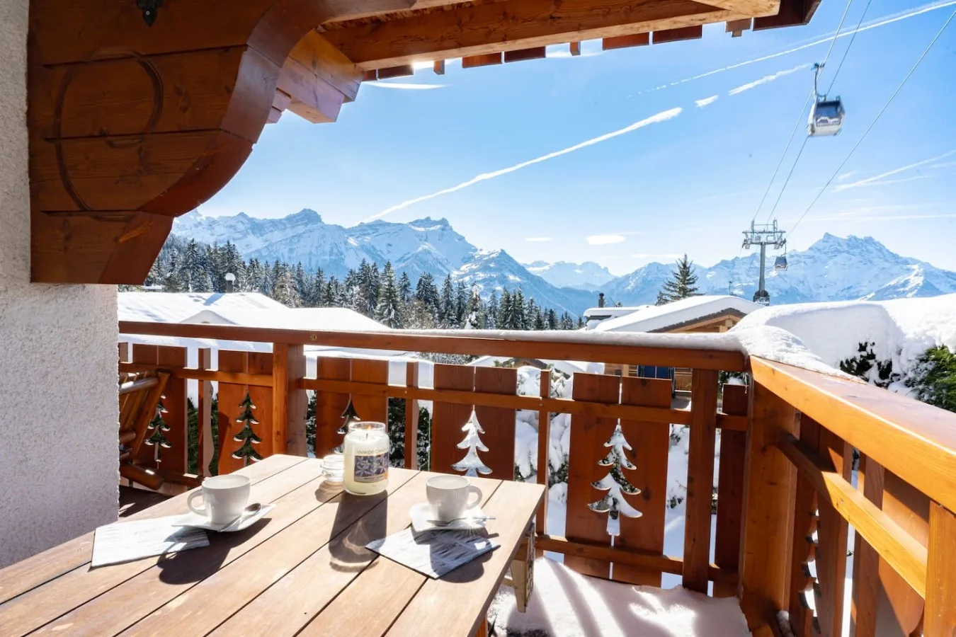 Snow-covered balcony with view of the gondola and the Alps, Villars-sur-Ollon