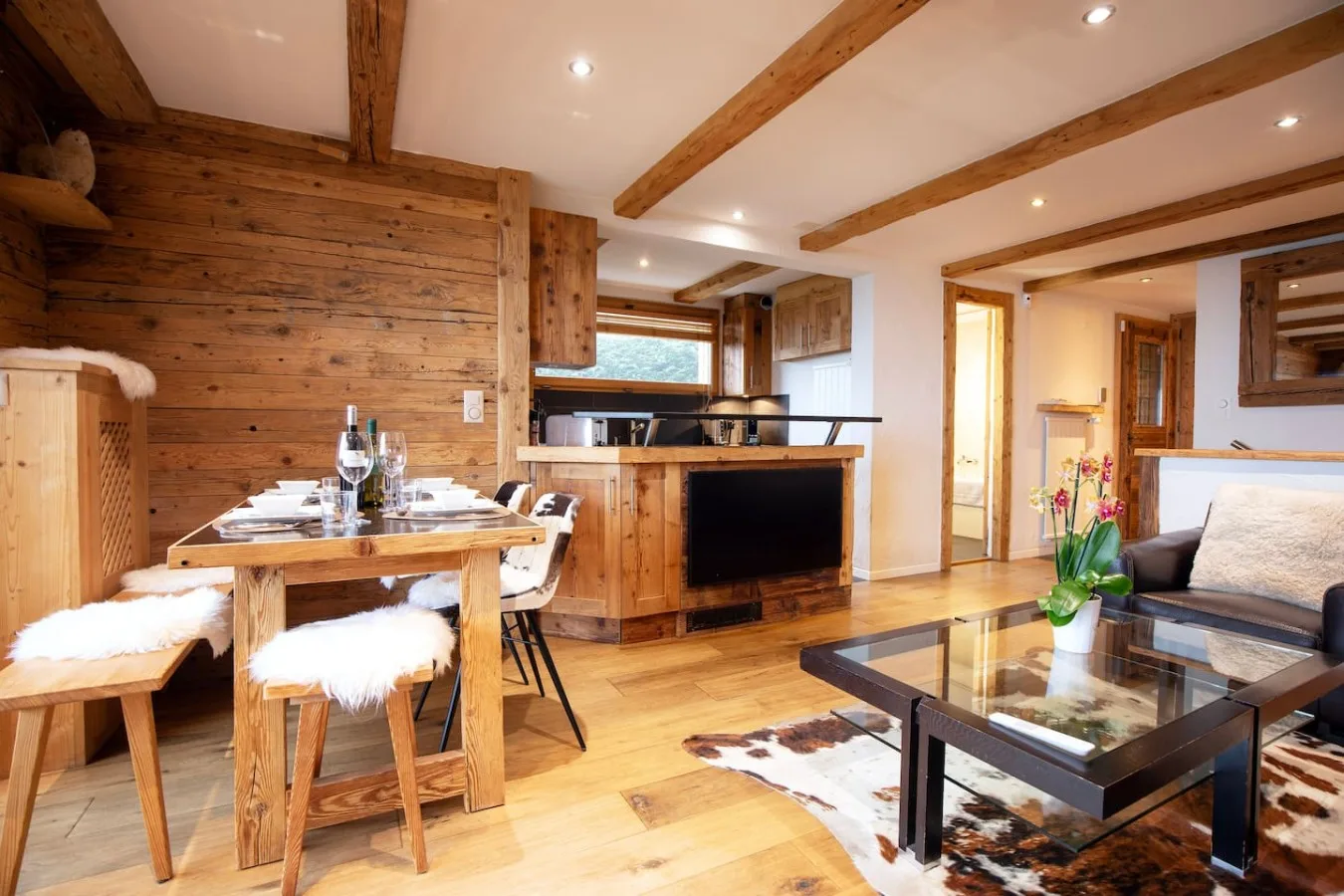 Dining table and open kitchen of the apartment, Villars