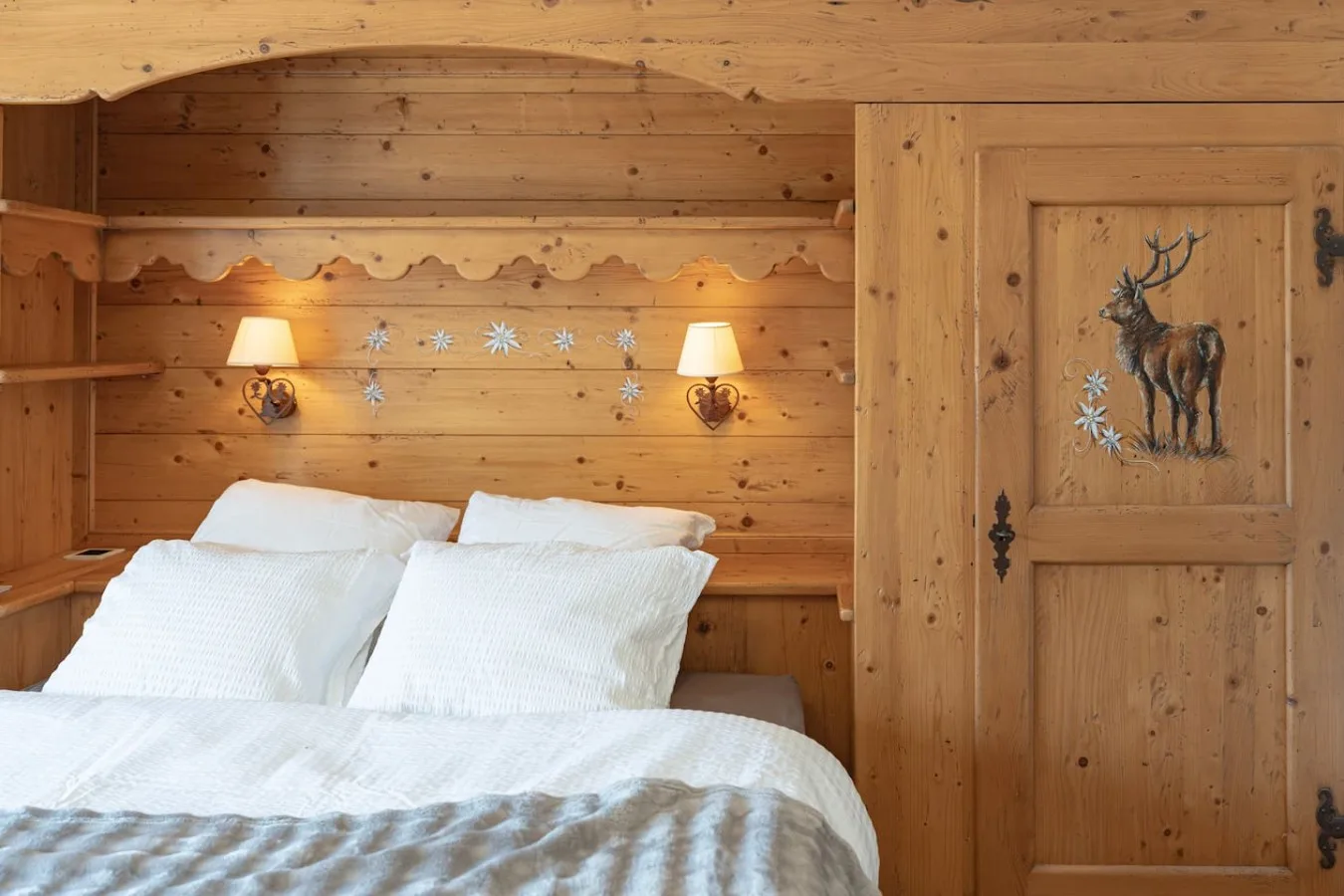 Second wooden bedroom with large bed and painted wardrobe, Villars-sur-Ollon