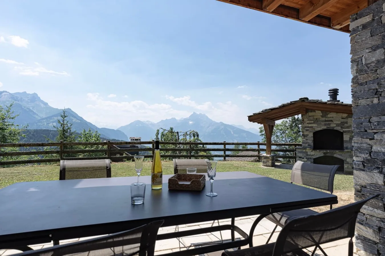 Table on the private terrace with mountain views, apartment with sauna in Villars